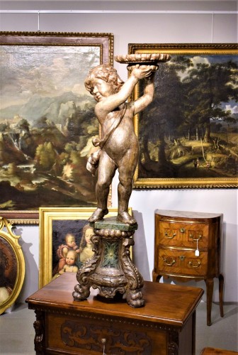 Antiquités - Putto porte torchère  en bois argenté, Venise 18e siècle